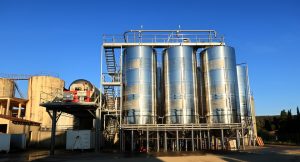 three large silos installed to store things, mechanical services